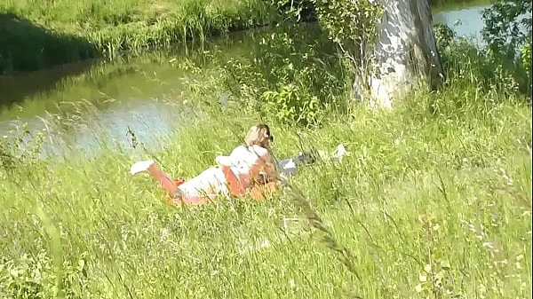 Milf sexy woman sunbathing naked on river bank. Random guy is watching. Naked in public. Public. Publicly. Wild beach Nudist. Perfect ass. Pussy. Blonde. Doggystyle. Woman got into doggy style position. Outdoor. Outside. Outdoors. Nudists. Naturist. POV