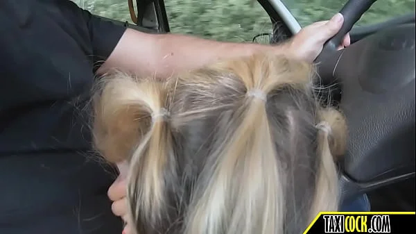 blonde girl makes a blowjob while dude is driving